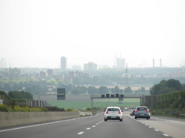 Approaching Cologne in September 2011, the twin spires of the city's famous cathedral visible through - we think - early morning haze.
