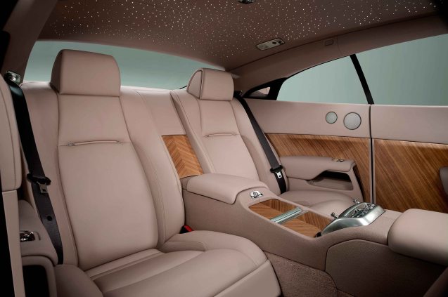 The ravishing rear seats of the Rolls-Royce Wraith, defined with striking new ‘Canadel Panelling’.