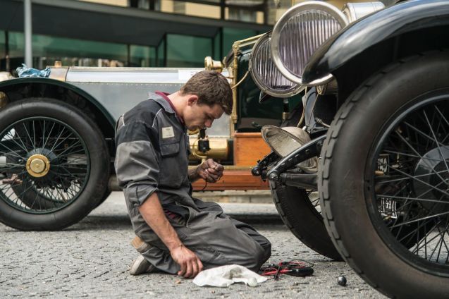 A mechanic takes the opportunity to fettle a car on a rest day in Opatija, Croatia.