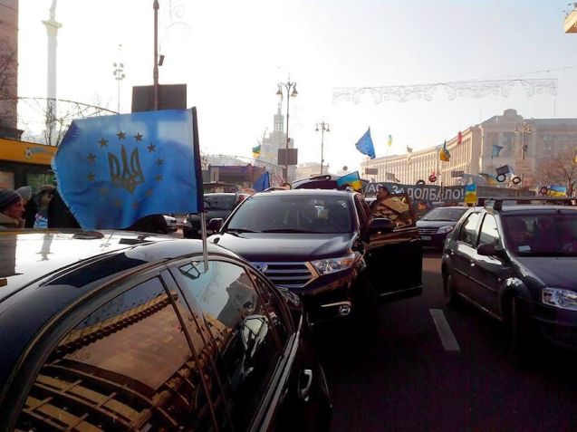 Freedom Fighters: protestors assemble in central Kiev yesterday morning before driving out to President Yanukovych's country house. Whether it's Ukraine, Russia or Belarus, recently drivers' groups have found themselves at the forefront of freedom campaigns. More later.