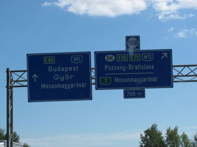 The xxxkm Hungarian M1 links Budapest with the Austrian border via Gyor, the sixth biggest city, pop. 131k, where Audi builds 90% of its engines. This is an early taste of the massively long Hungarian words. Watch out: places in the same area often start with the same letters. In the immediate vicinity of Mosonmagyarovar are Mosonszentjanos, Mosonszolnok, Mosonszentmiklos and Mosonudvar. Not easy to discern at 130kmh.