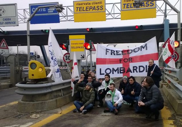 Demonstrators block the automatic toll payment lane on the A4 at Milan North today.