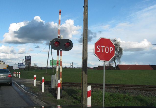 Stop means stop. Every single truck, vana nd car - even in this queue we're in - stops to check if a train is coming, and so do we.