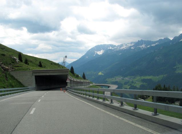 The H2 Gotthard Pass road is wide and smooth as befits what is actually a major road, the well trod alternative to the busy Gotthard Tunnel during the summer (it closes during the winter). It doesn’t lack for drama however, the road way curving visibly away from the mountainside in a classic, albeit broad, hairpin descent down into Airolo.