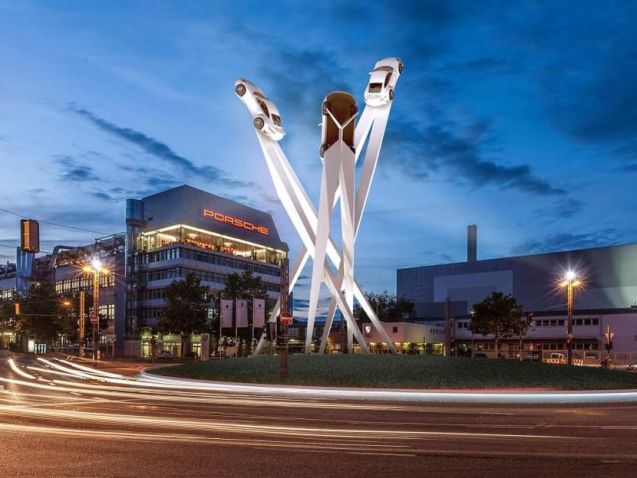 Porsche submits a planning application today about erecting this Goodwood-style sculpture between its museum and factory on Porscheplatz in Zuffenhausen north east Stuttgart. Twenty four meters high, and ten wide, each of the three steel spikes has a different 911 model at the top to represent fifty years of the car’s manufacture at the site. Presuming permission is granted, the sculpture will be built next summer and unveiled in the autumn.